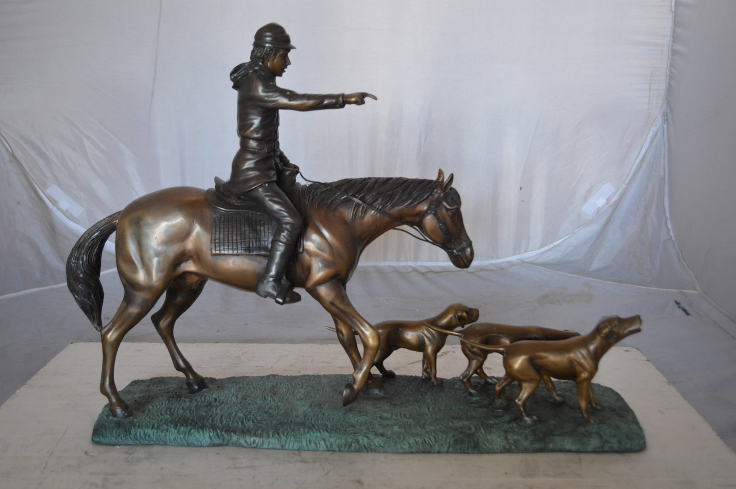 Hunter with three dogs Bronze Statue - Size: 27"L x 6"W x 18"H.