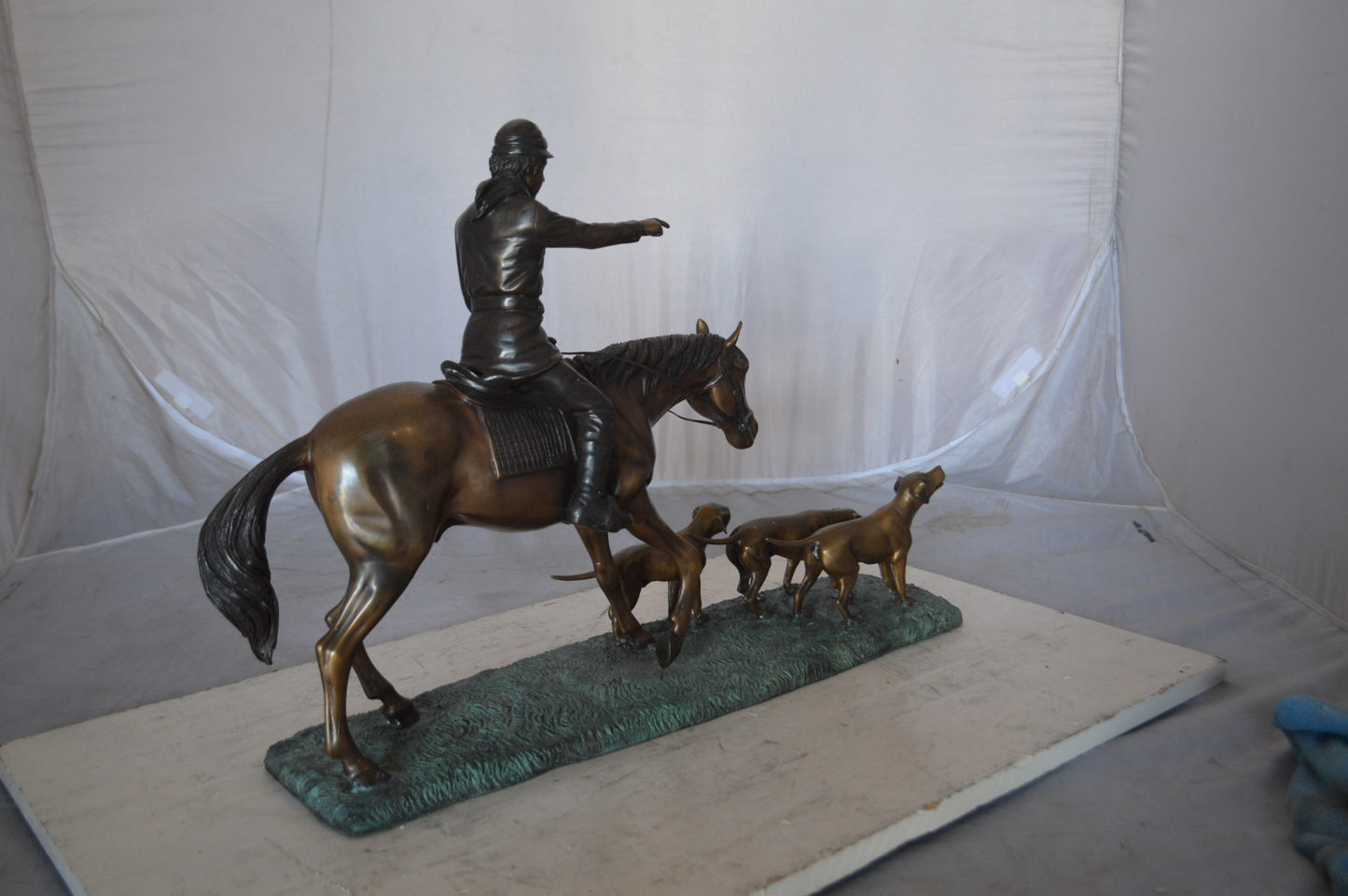 Hunter with three dogs Bronze Statue - Size: 27"L x 6"W x 18"H.
