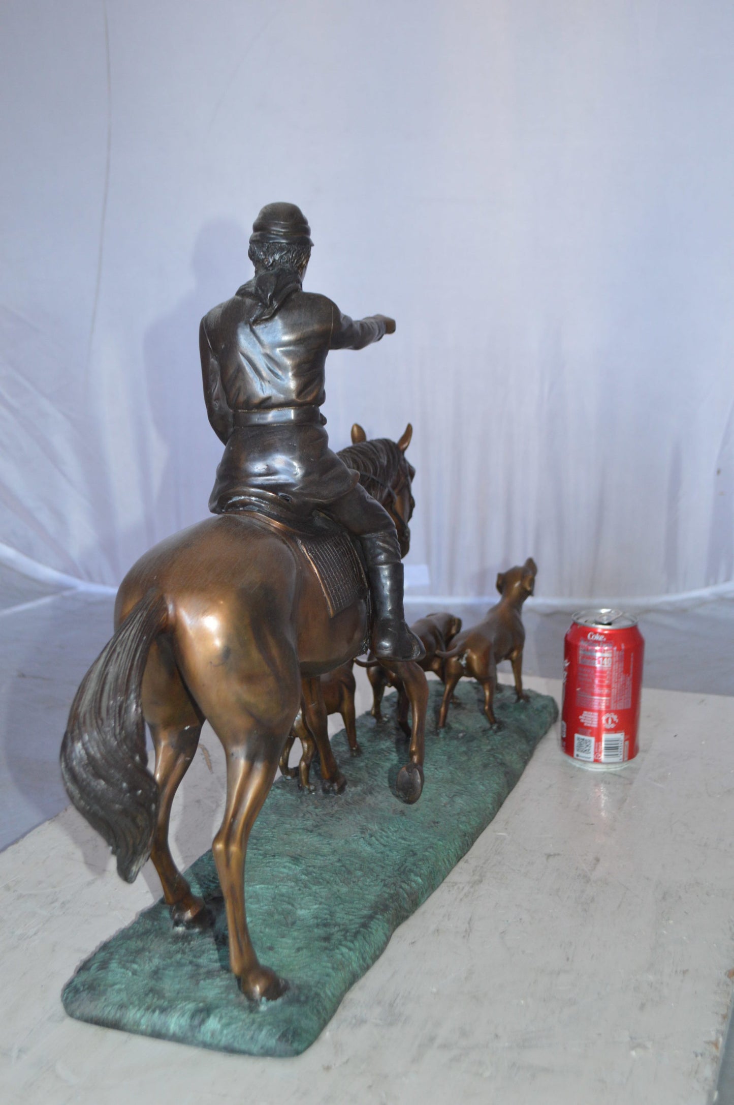 Hunter with three dogs Bronze Statue - Size: 27"L x 6"W x 18"H.
