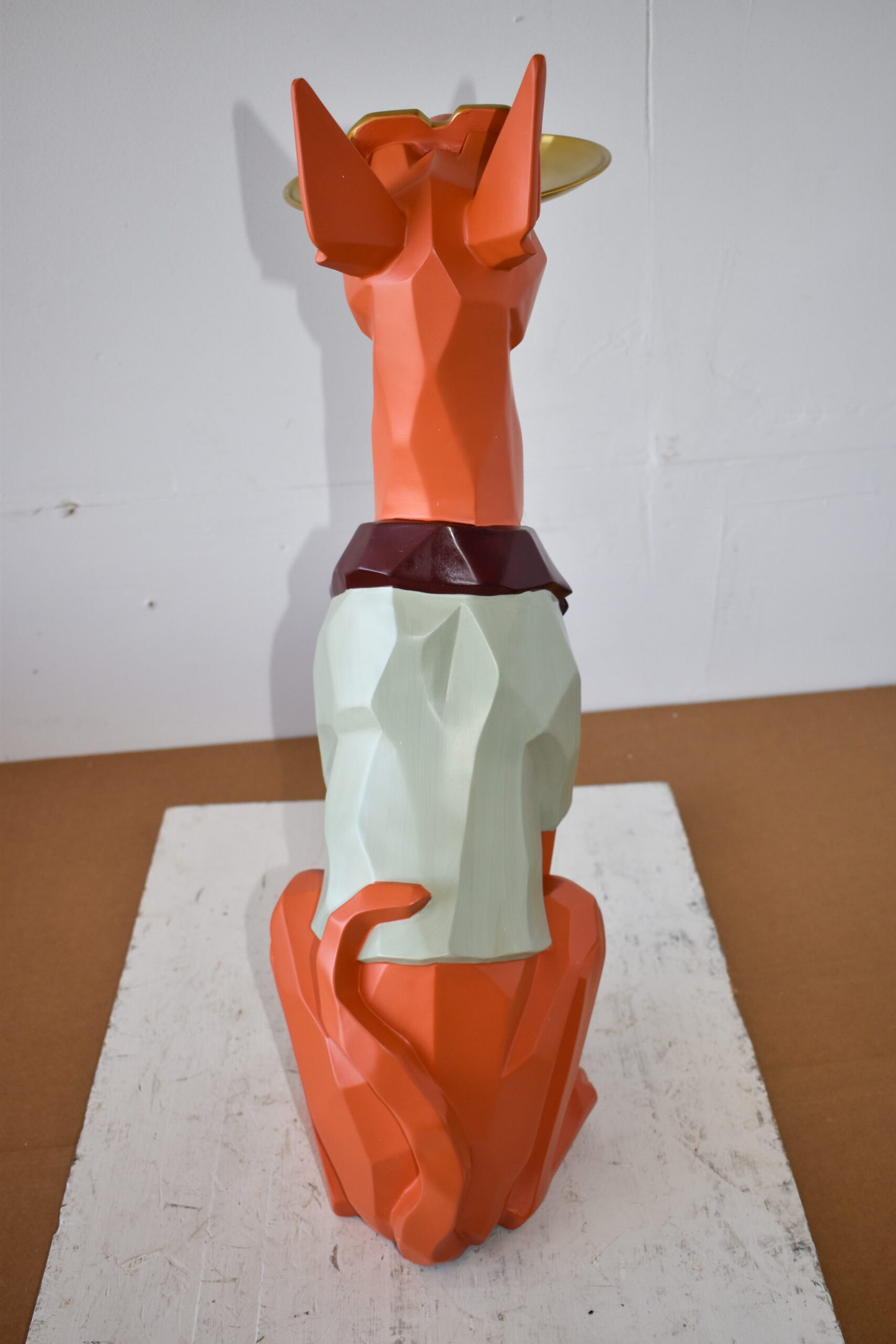 Happy Hostess Dog Resin Statue with Orange and White Finish 19" x 9" x 28"H