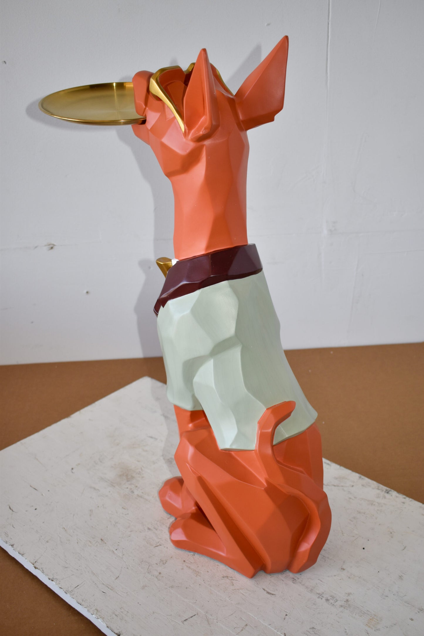 Happy Hostess Dog Resin Statue with Orange and White Finish 19" x 9" x 28"H