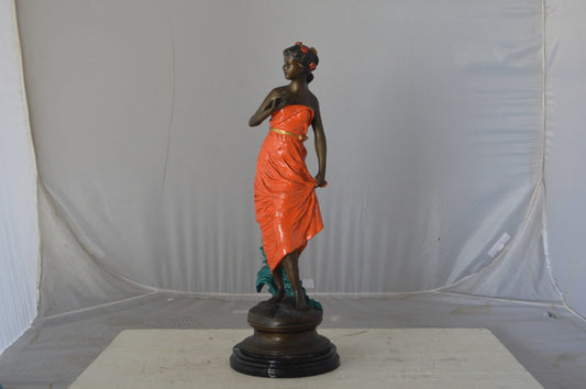 Young lady in orange bronze statue - Size: 7"L x 26"W x 25"H.