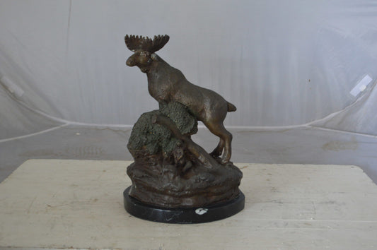 Moose on a rock bronze statue - Size: 9"L x 7"W x 14"H.