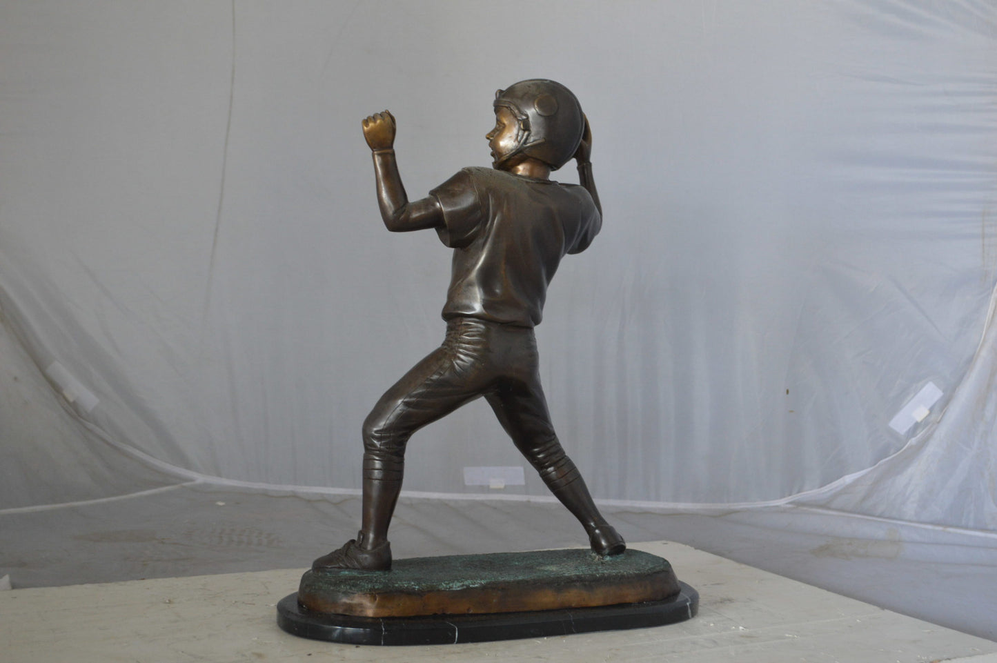 Young Quarterback bronze statue - Size: 14"L x 6"W x 20"H.