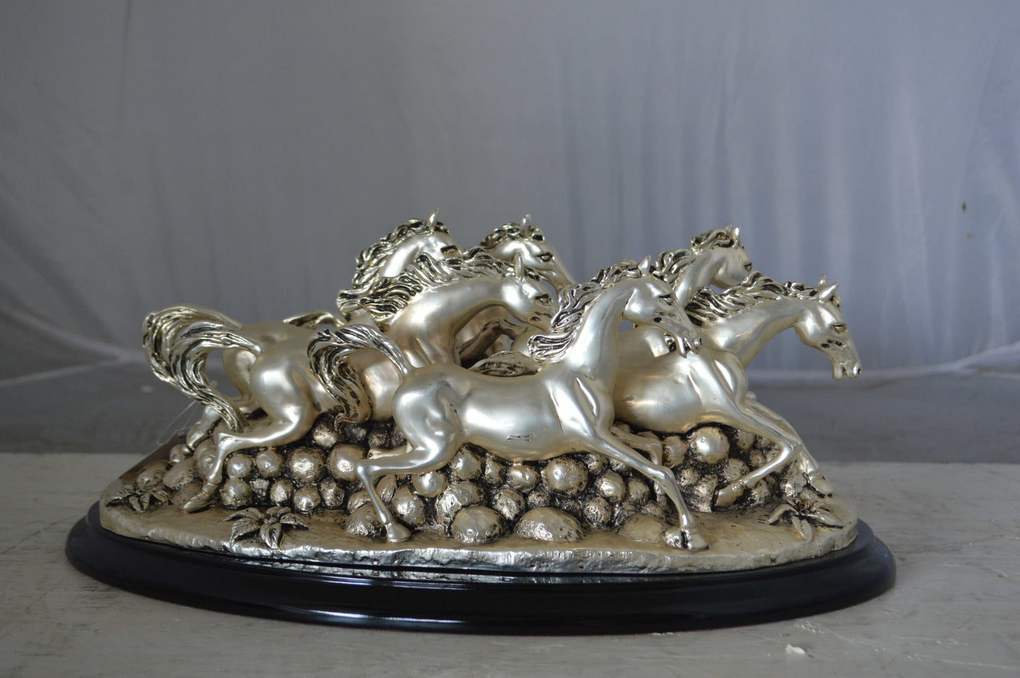 Charging horses resin statue on wood base - Size: 17"L x 10"W x 5"H.