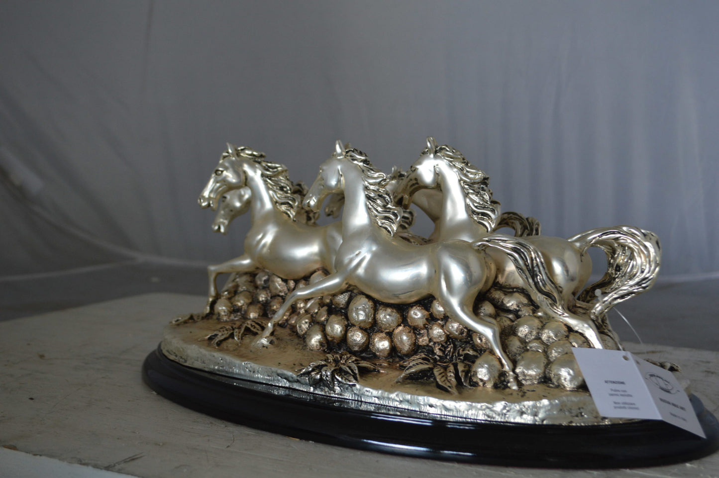 Charging horses resin statue on wood base - Size: 17"L x 10"W x 5"H.