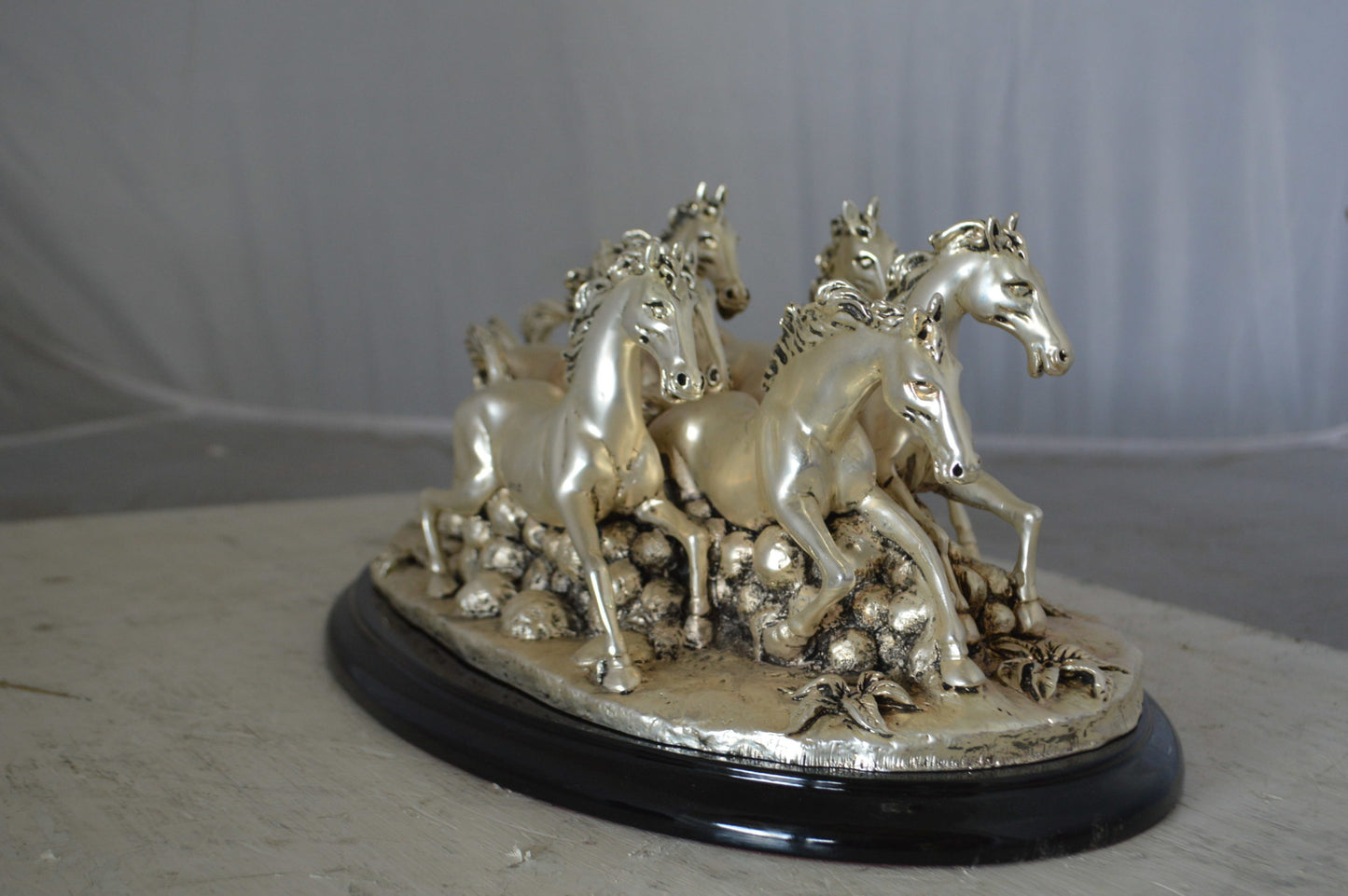 Charging horses resin statue on wood base - Size: 17"L x 10"W x 5"H.