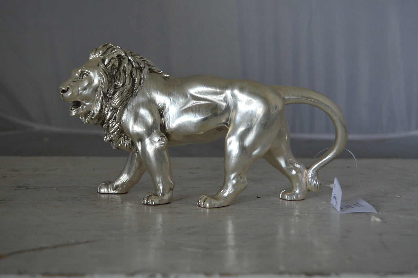 Walking Lion made of resin statue - Size: 10"L x 3"W x 6"H.