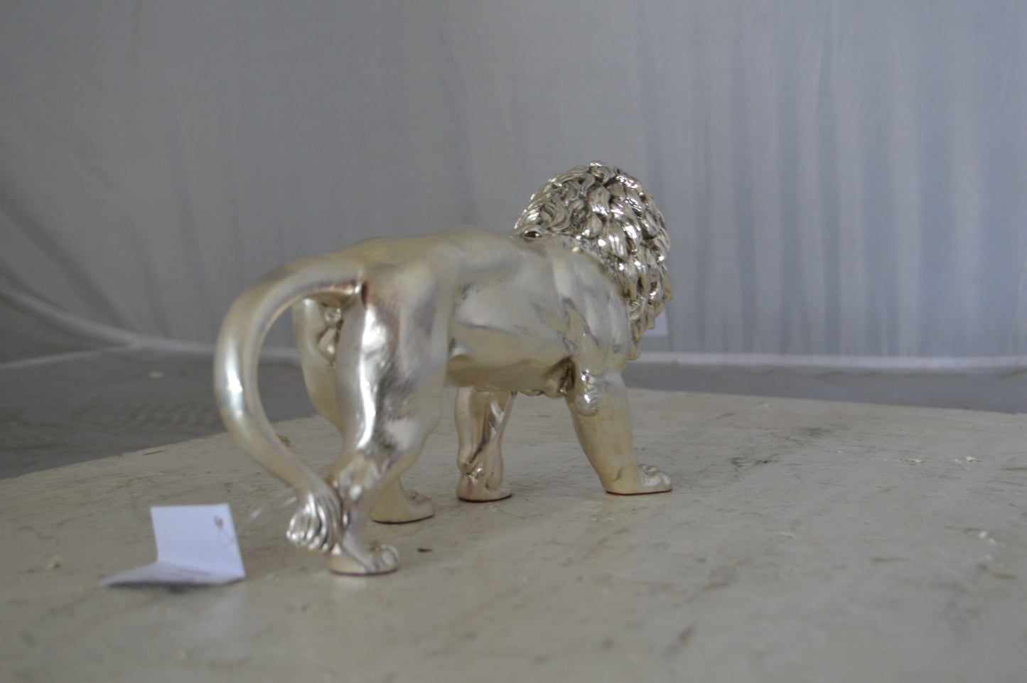 Walking Lion made of resin statue - Size: 10"L x 3"W x 6"H.