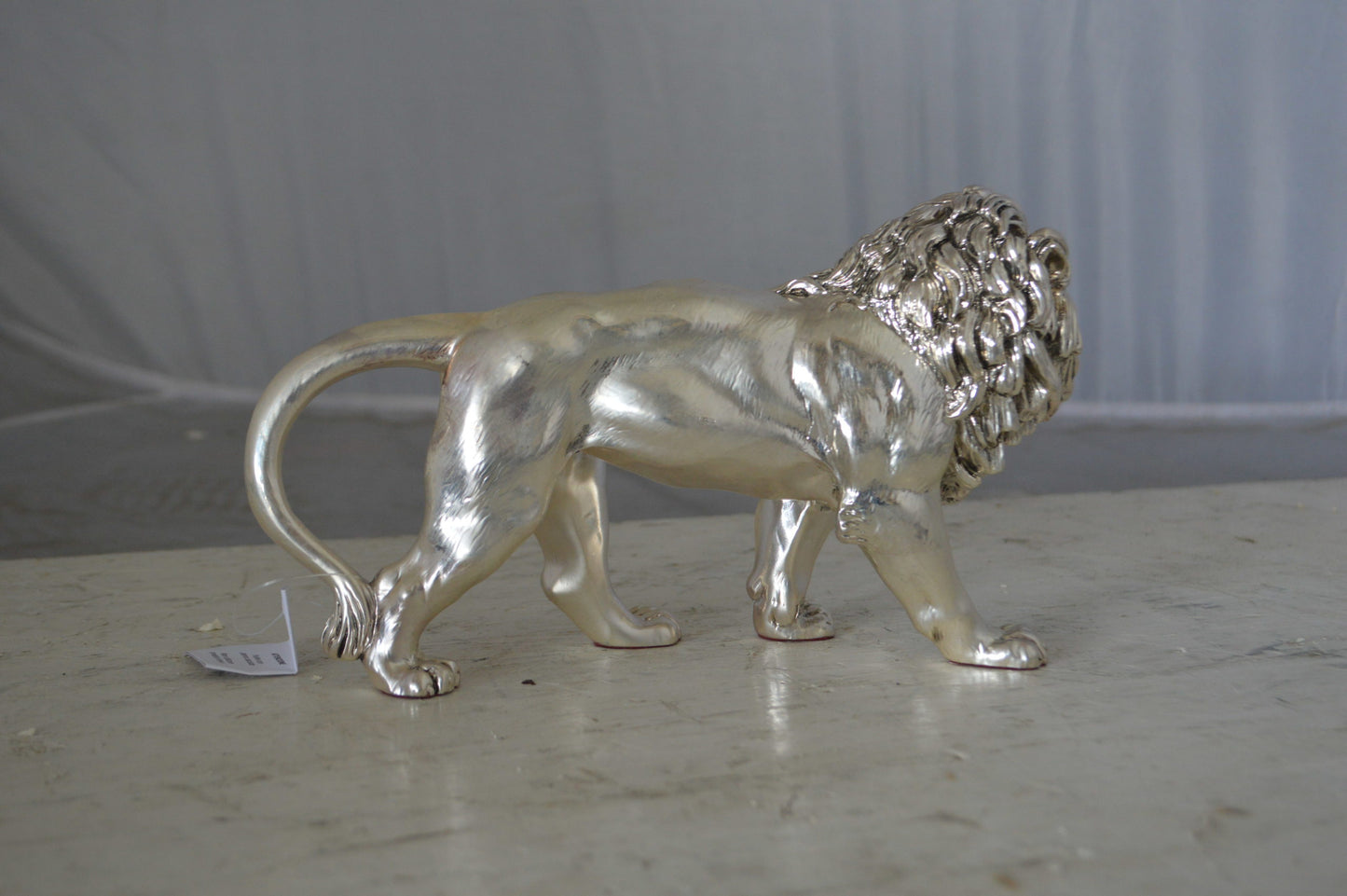 Walking Lion made of resin statue  - Size: 10"L x 3"W x 6"H.