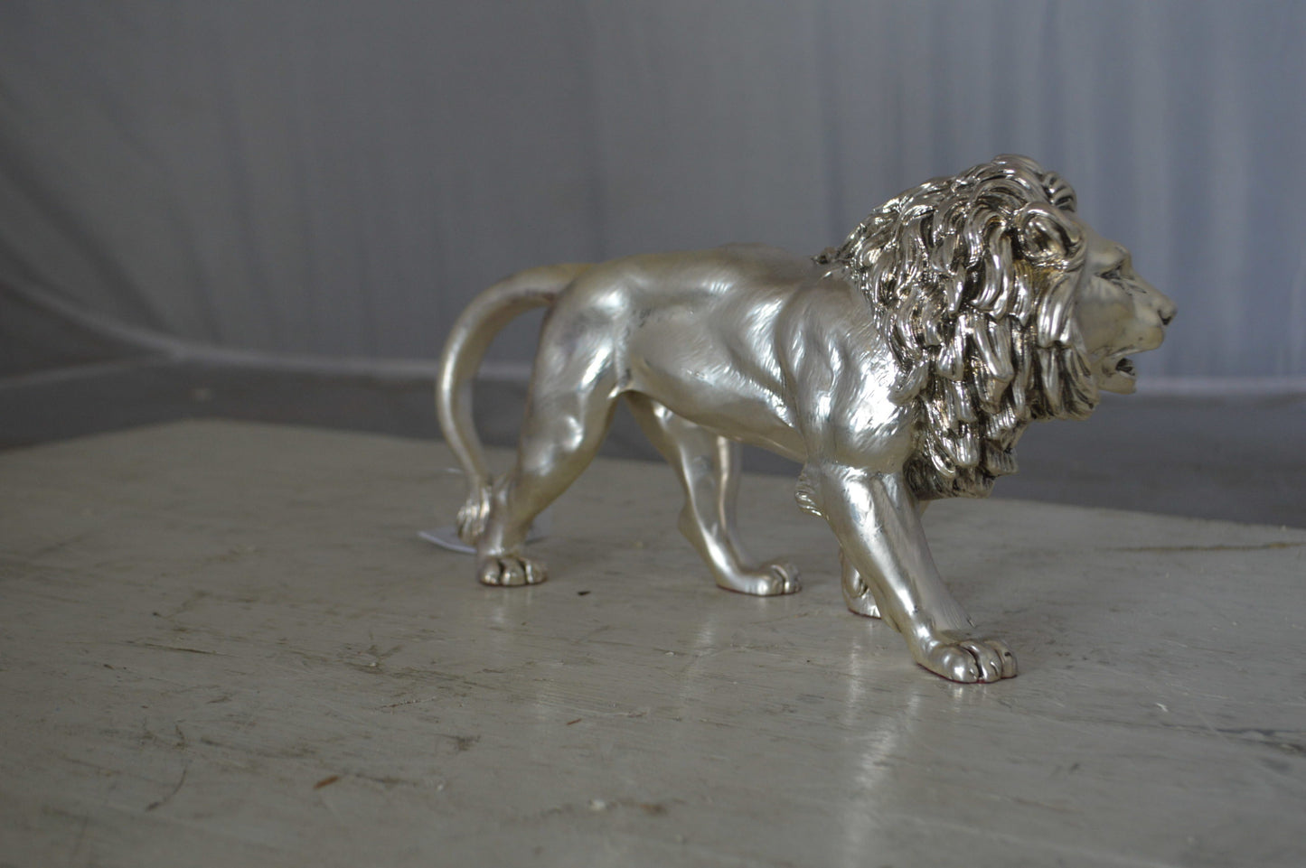 Walking Lion made of resin statue - Size: 10"L x 3"W x 6"H.