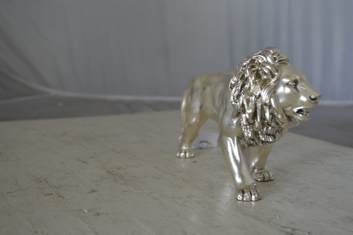 Walking Lion made of resin statue - Size: 10"L x 3"W x 6"H.