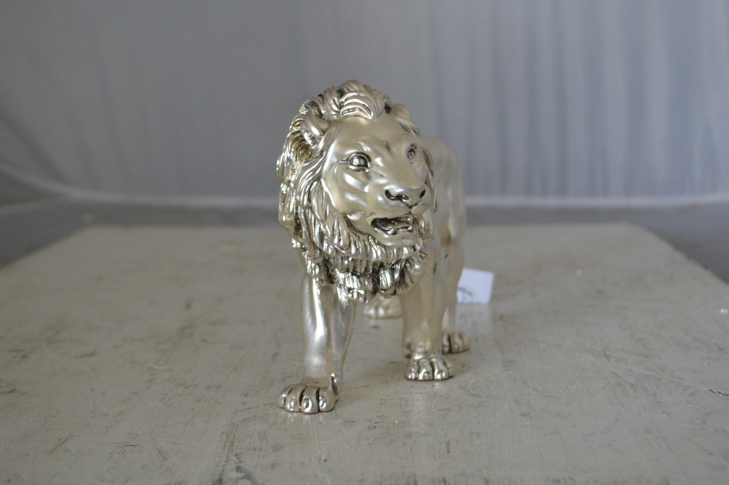 Walking Lion made of resin statue - Size: 10"L x 3"W x 6"H.