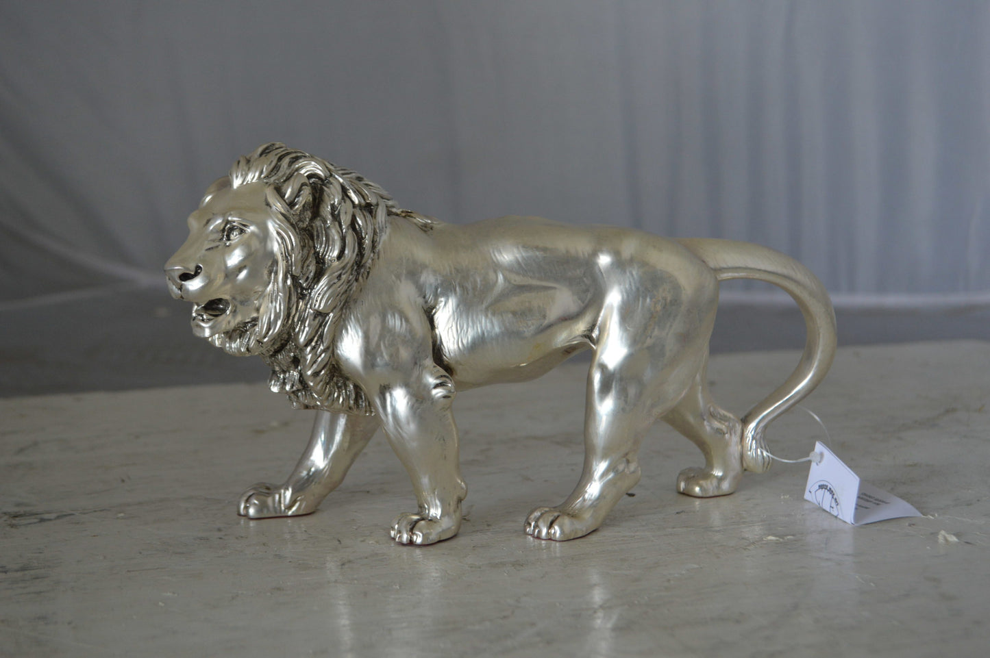 Walking Lion made of resin statue  - Size: 10"L x 3"W x 6"H.