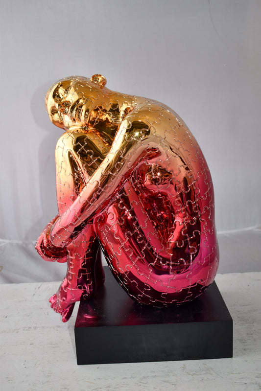 Puzzle Patterned Cradled Woman Resin Statue on Black Base Size: 13" x 12" x 19"H
