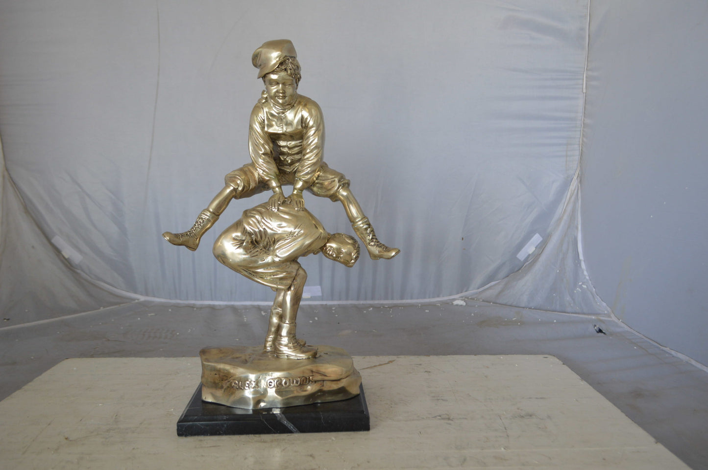 Leapfrog bronze statue silver finish - Size: 12"L x 7"W x 19"H.