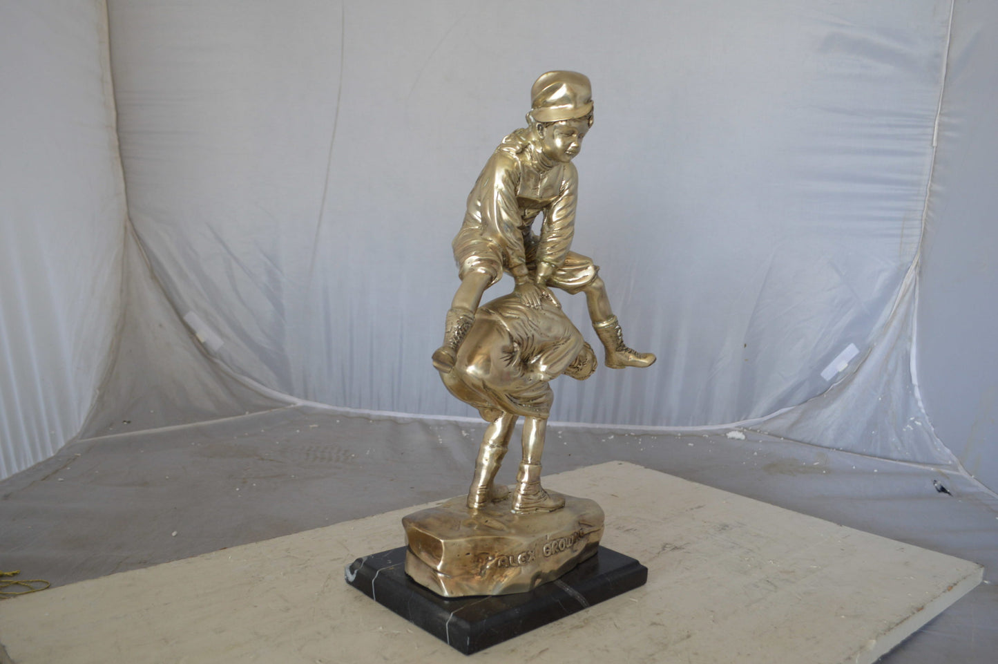 Leapfrog bronze statue silver finish - Size: 12"L x 7"W x 19"H.