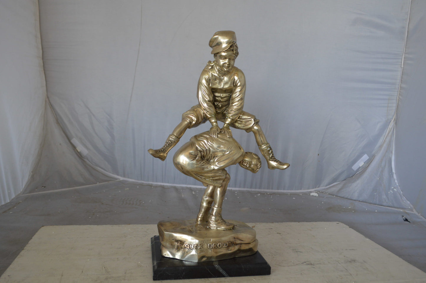Leapfrog bronze statue silver finish - Size: 12"L x 7"W x 19"H.