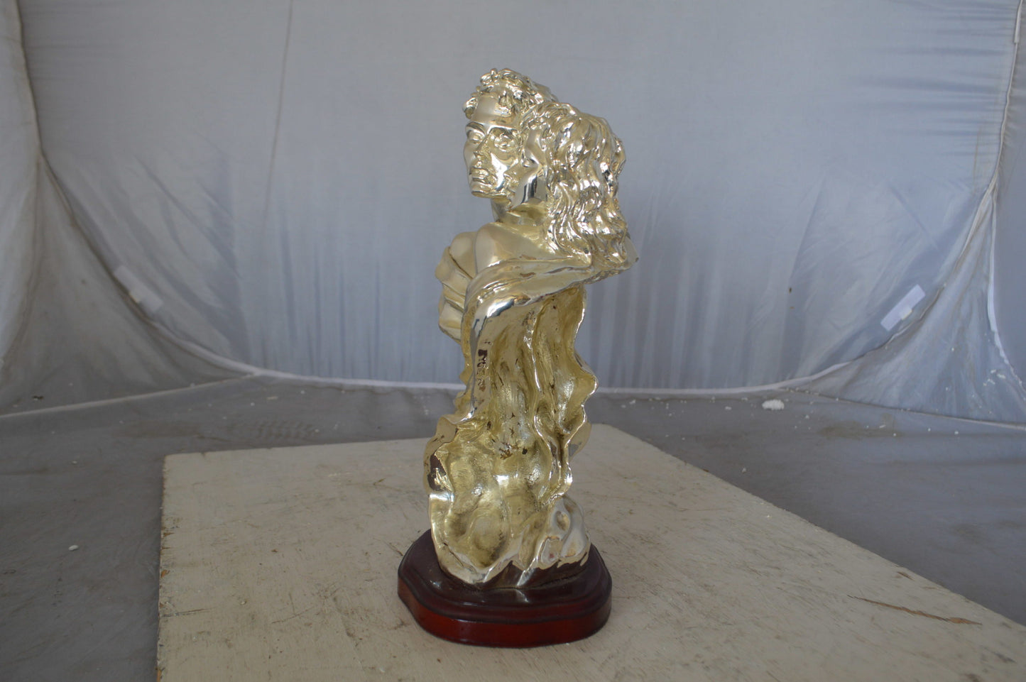 Lovers resin statue on wood base - Size: 8"L x 5"W x 14"H.
