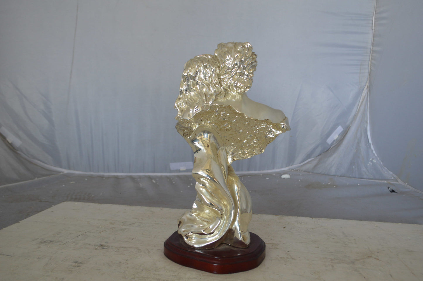 Lovers resin statue on wood base - Size: 8"L x 5"W x 14"H.
