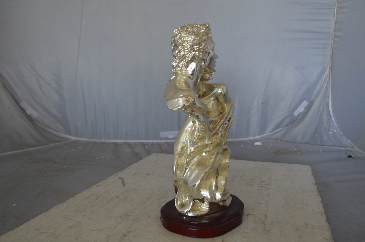 Lovers resin statue on wood base - Size: 8"L x 5"W x 14"H.