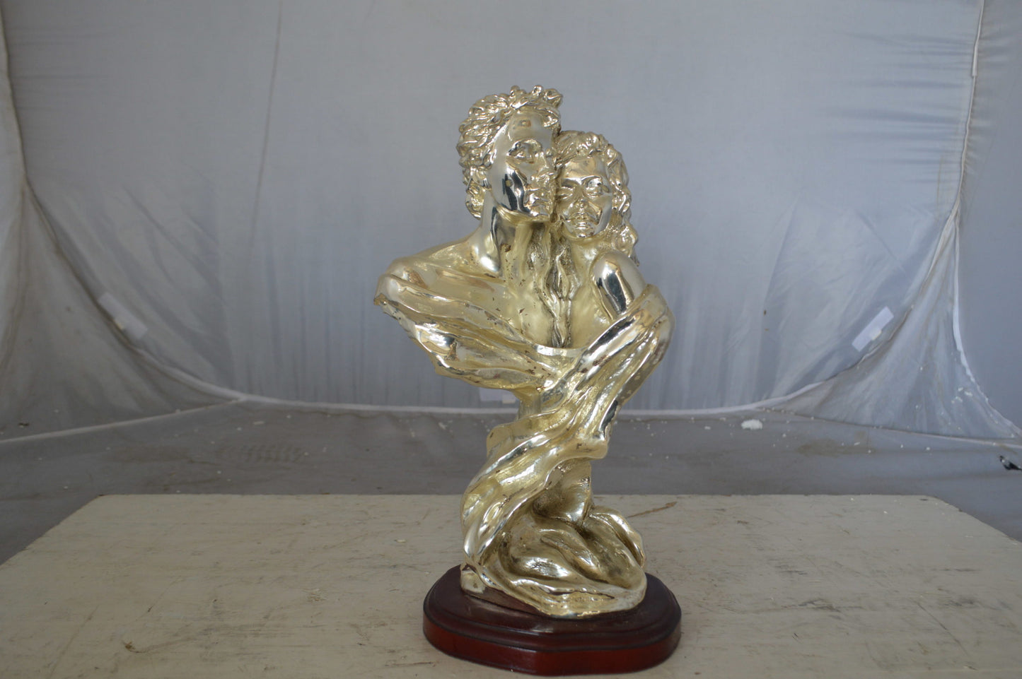 Lovers resin statue on wood base - Size: 8"L x 5"W x 14"H.
