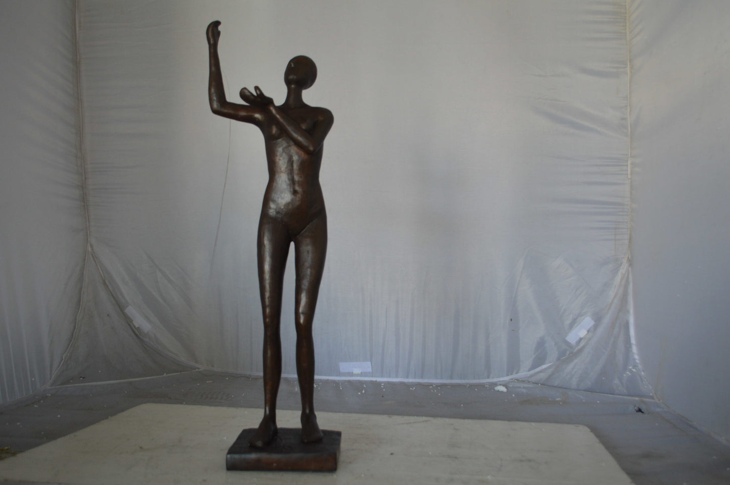 Abstract of Art nude lady lifting hand bronze statue - Size: 9"L x 6"W x 25"H.