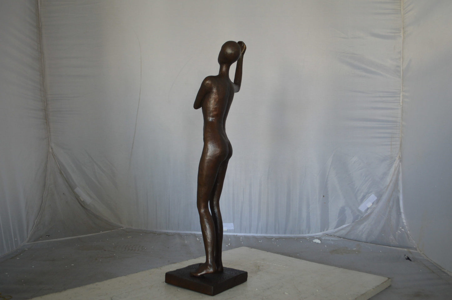 Abstract of Art nude lady lifting hand bronze statue - Size: 9"L x 6"W x 25"H.