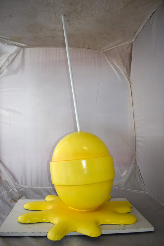 Giant Yellow Lollipop Melted on The Ground Resin Statue Size: 31" x 27" x 56"H