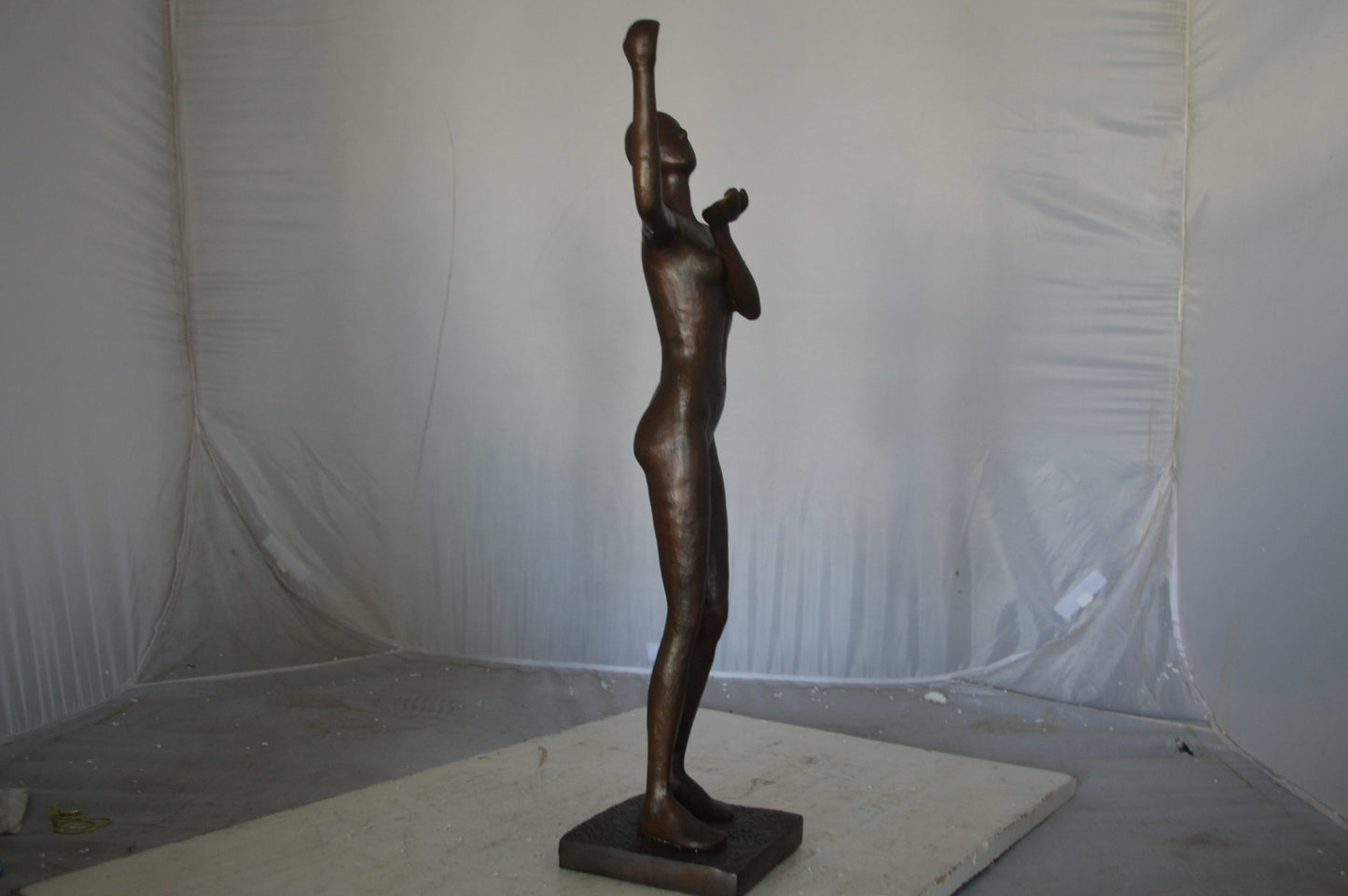 Abstract of Art nude lady lifting hand bronze statue - Size: 9"L x 6"W x 25"H.