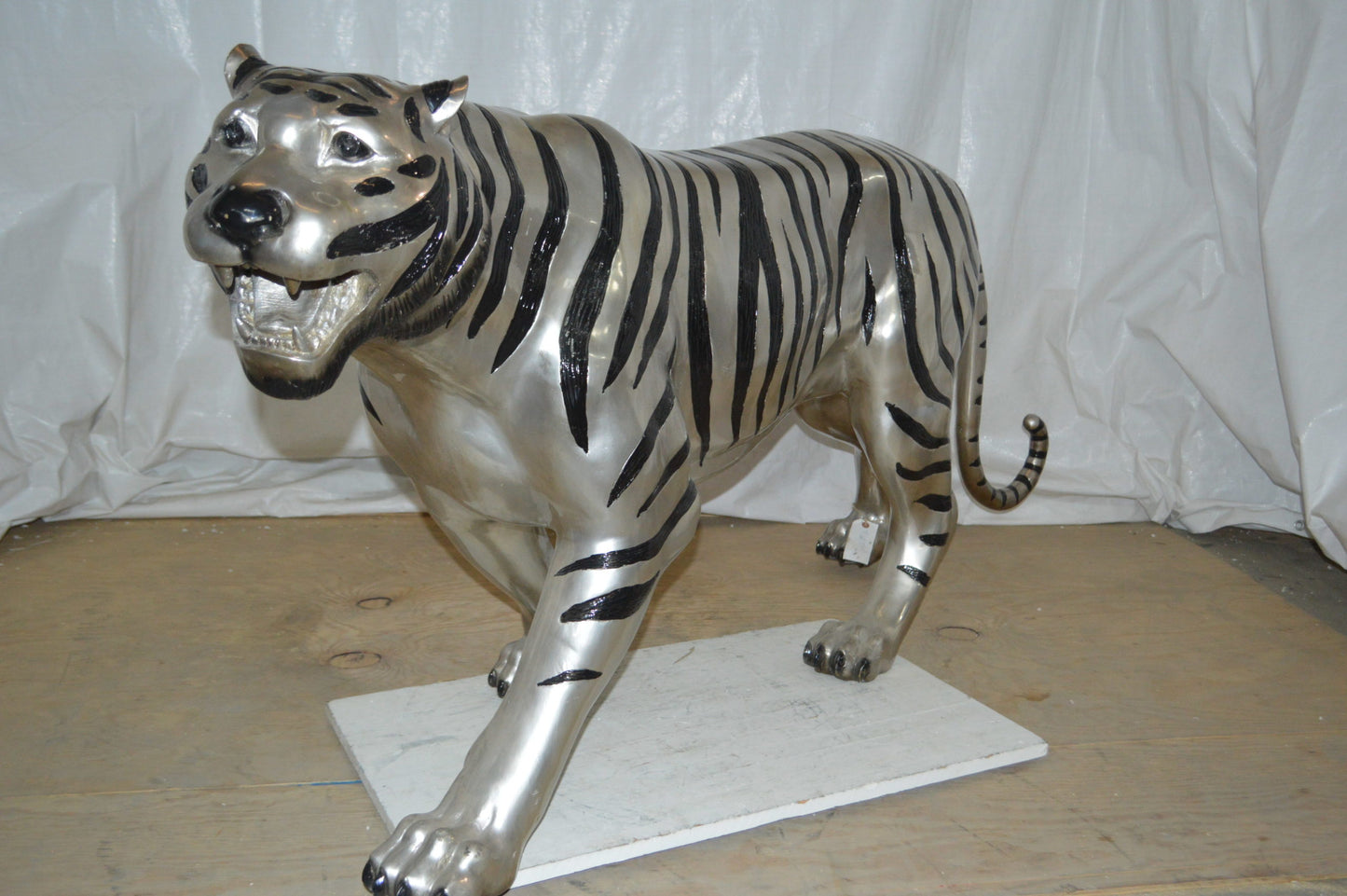 Tiger bronze statue with black and silver finish - Size: 80"L x 15"W x 34"H.