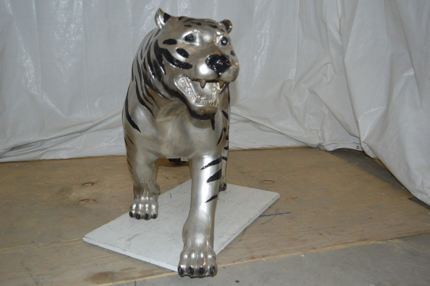 Tiger bronze statue with black and silver finish - Size: 80"L x 15"W x 34"H.