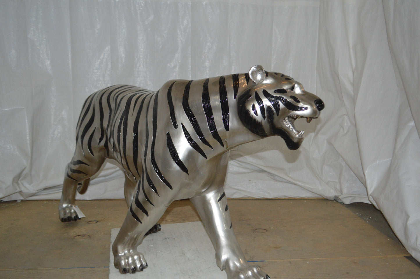 Tiger bronze statue with black and silver finish - Size: 80"L x 15"W x 34"H.