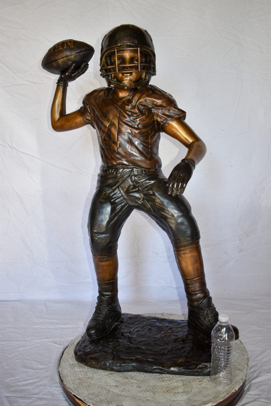 Young Boy Playing Football Bronze Statue Size: 26" x 14" x 43"H