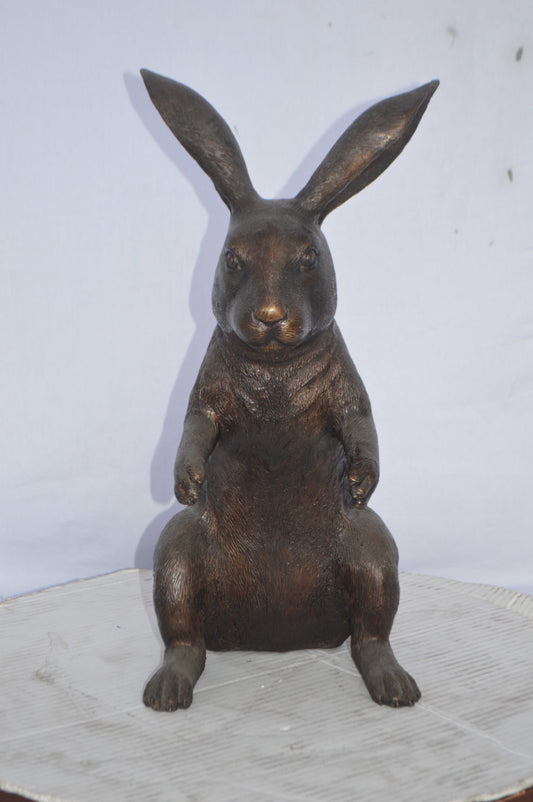 Rabbit looking down bronze statue - Size: 10"L x 12"W x 20"H.