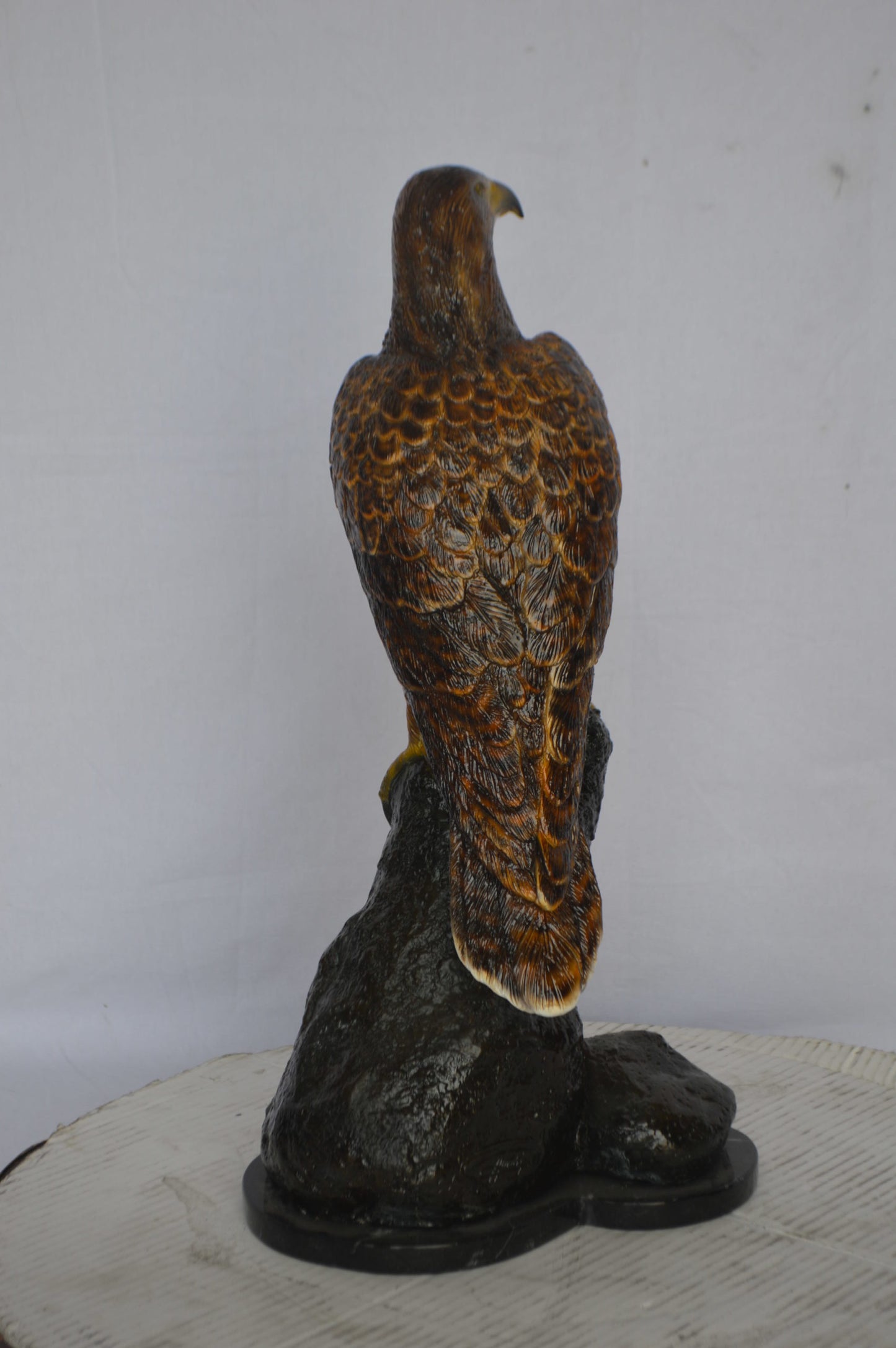 Hawk on a Rock bronze statue - Size: 12"L x 9"W x 22"H.