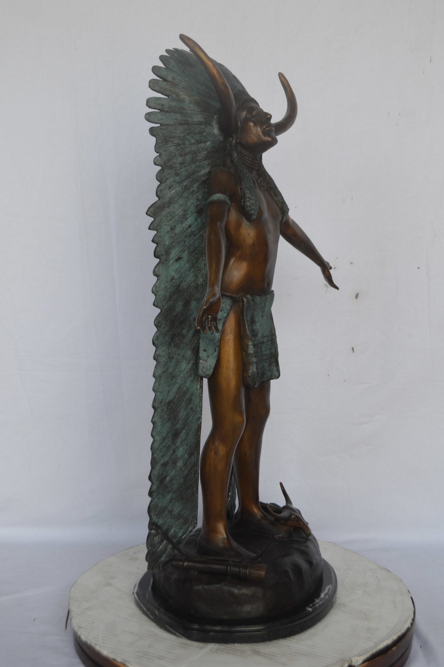 Indian with Plume bronze statue - Size: 22"L x 14"W x 38"H.