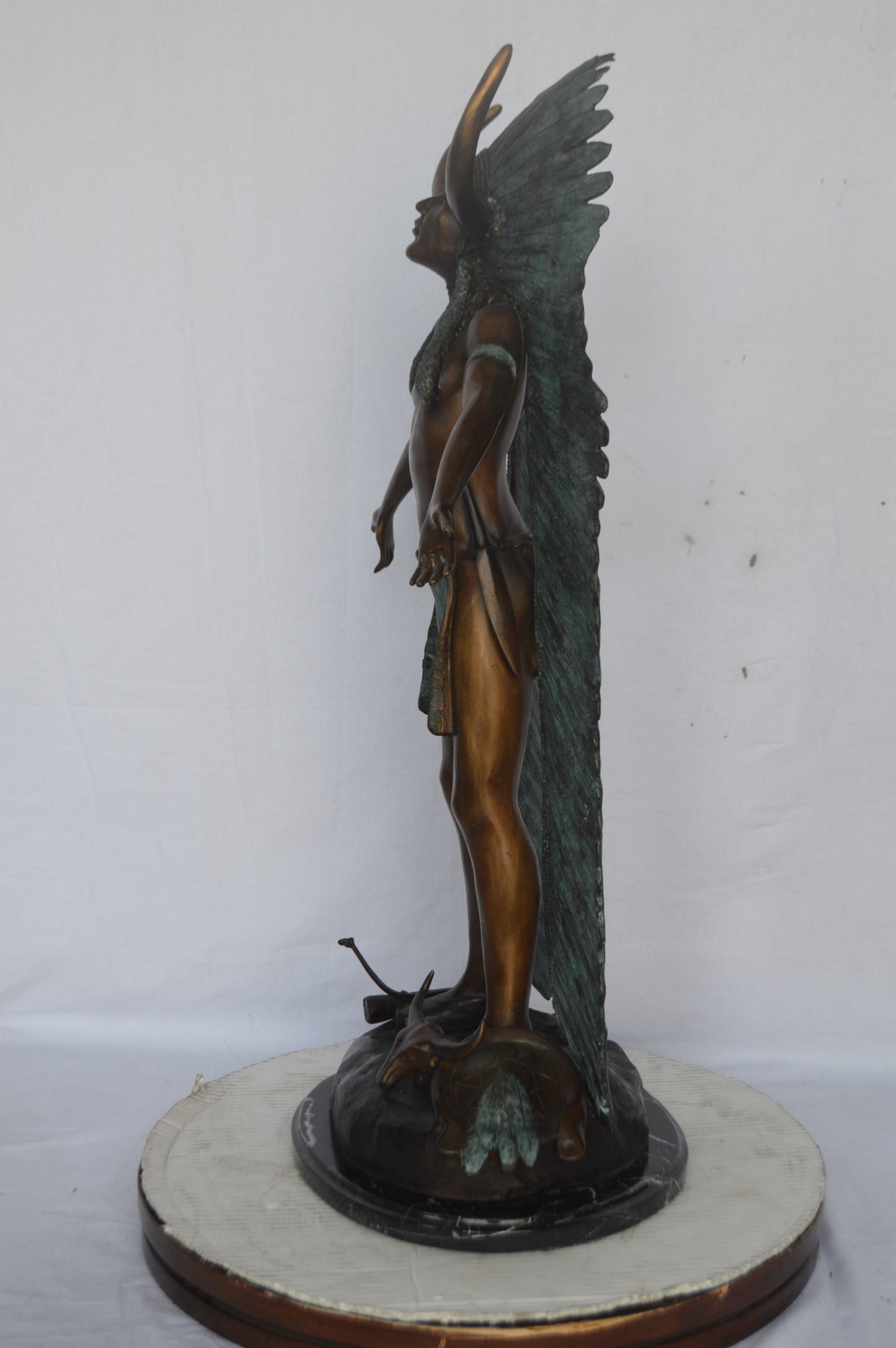 Indian with Plume bronze statue - Size: 22"L x 14"W x 38"H.