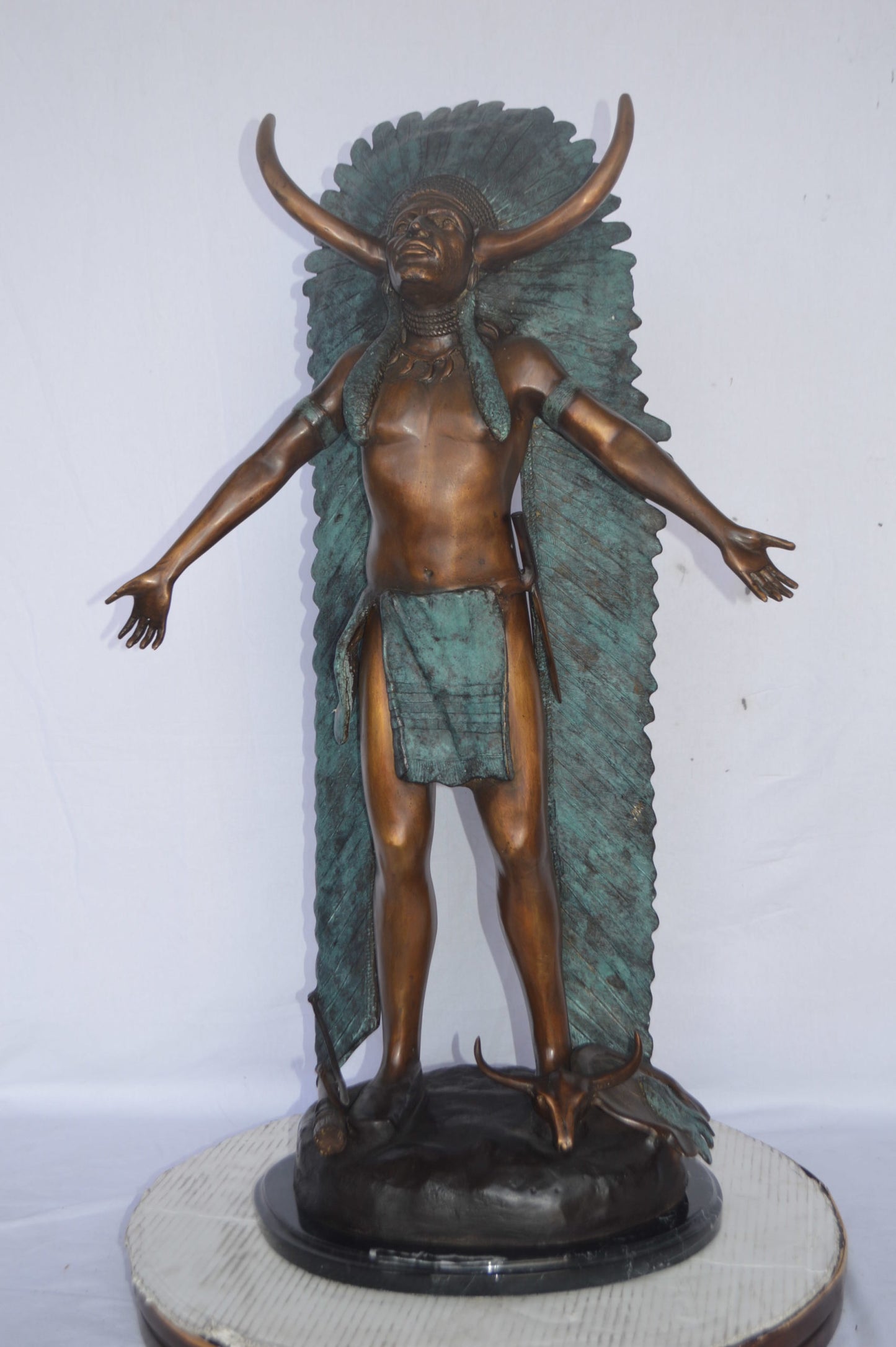 Indian with Plume bronze statue - Size: 22"L x 14"W x 38"H.