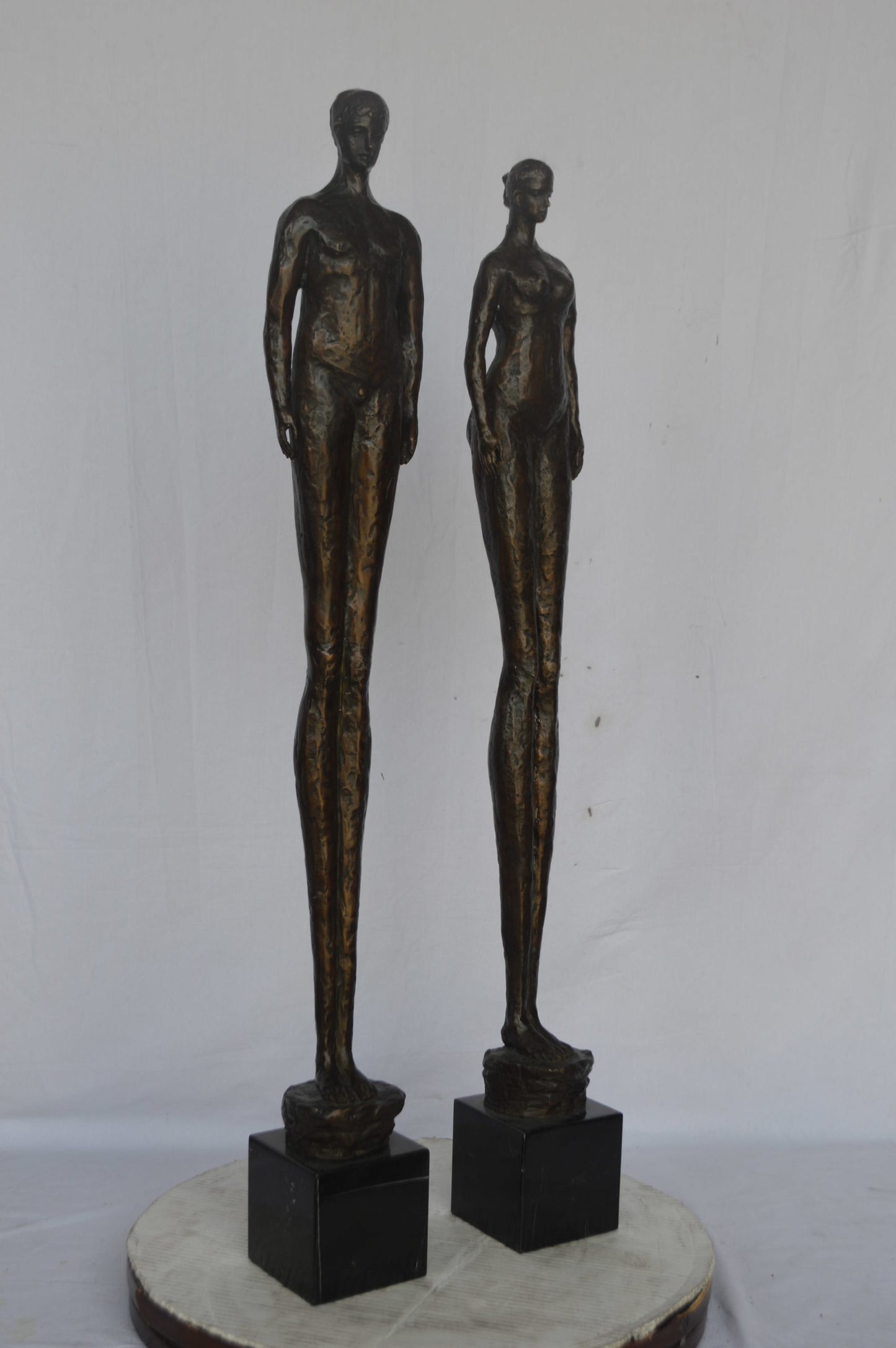 Modern art Pair, tall couple standing bronze statue - Size: 5"L x 5"W x 45"H.