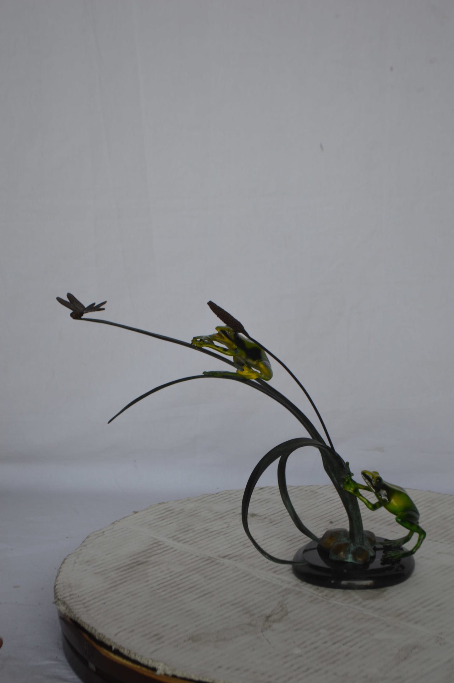 Two Green Frogs catching a dragonfly Bronze Statue - Size: 17"L x 10"W x 13"H.