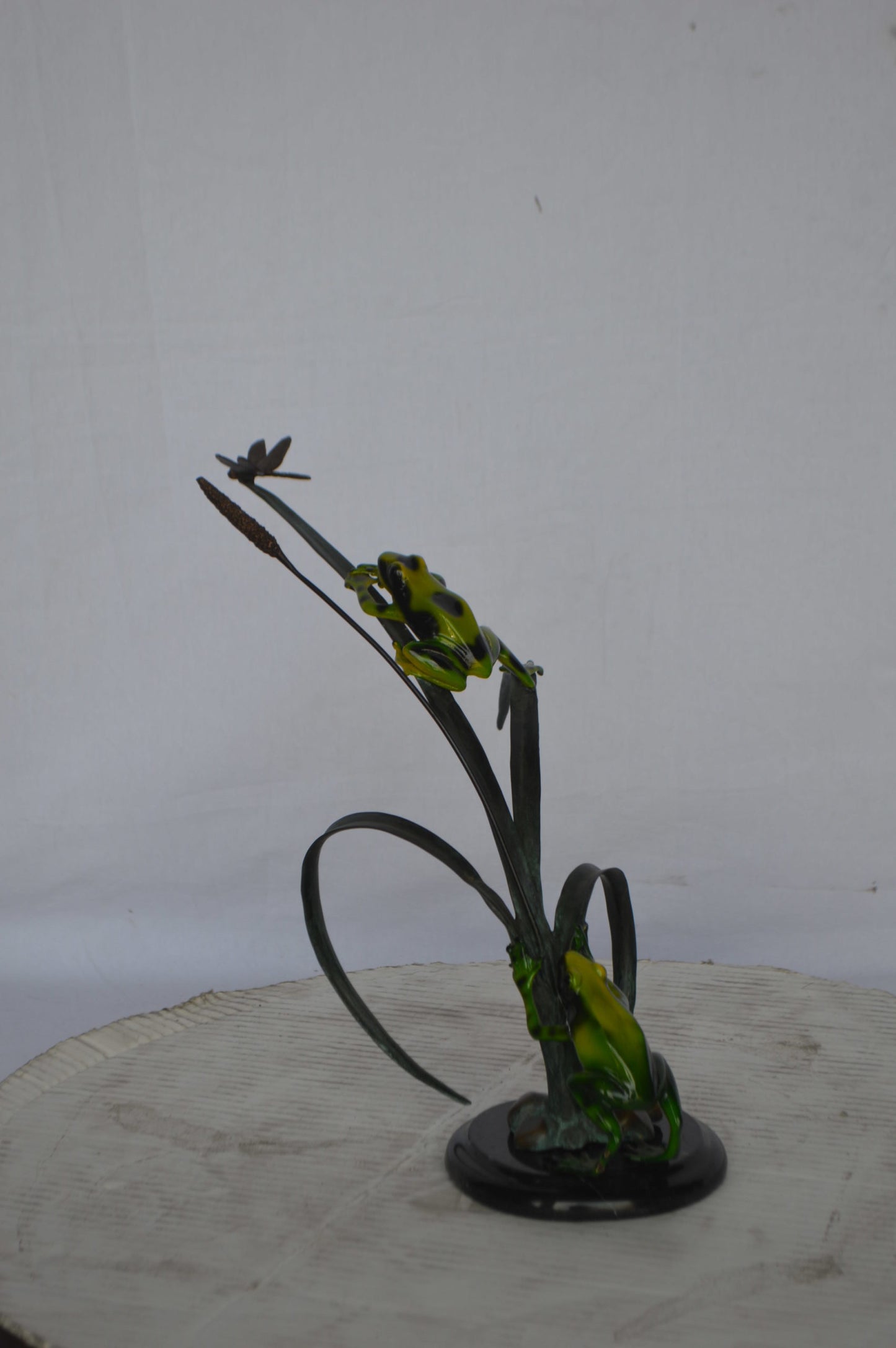 Two Green Frogs catching a dragonfly Bronze Statue - Size: 17"L x 10"W x 13"H.