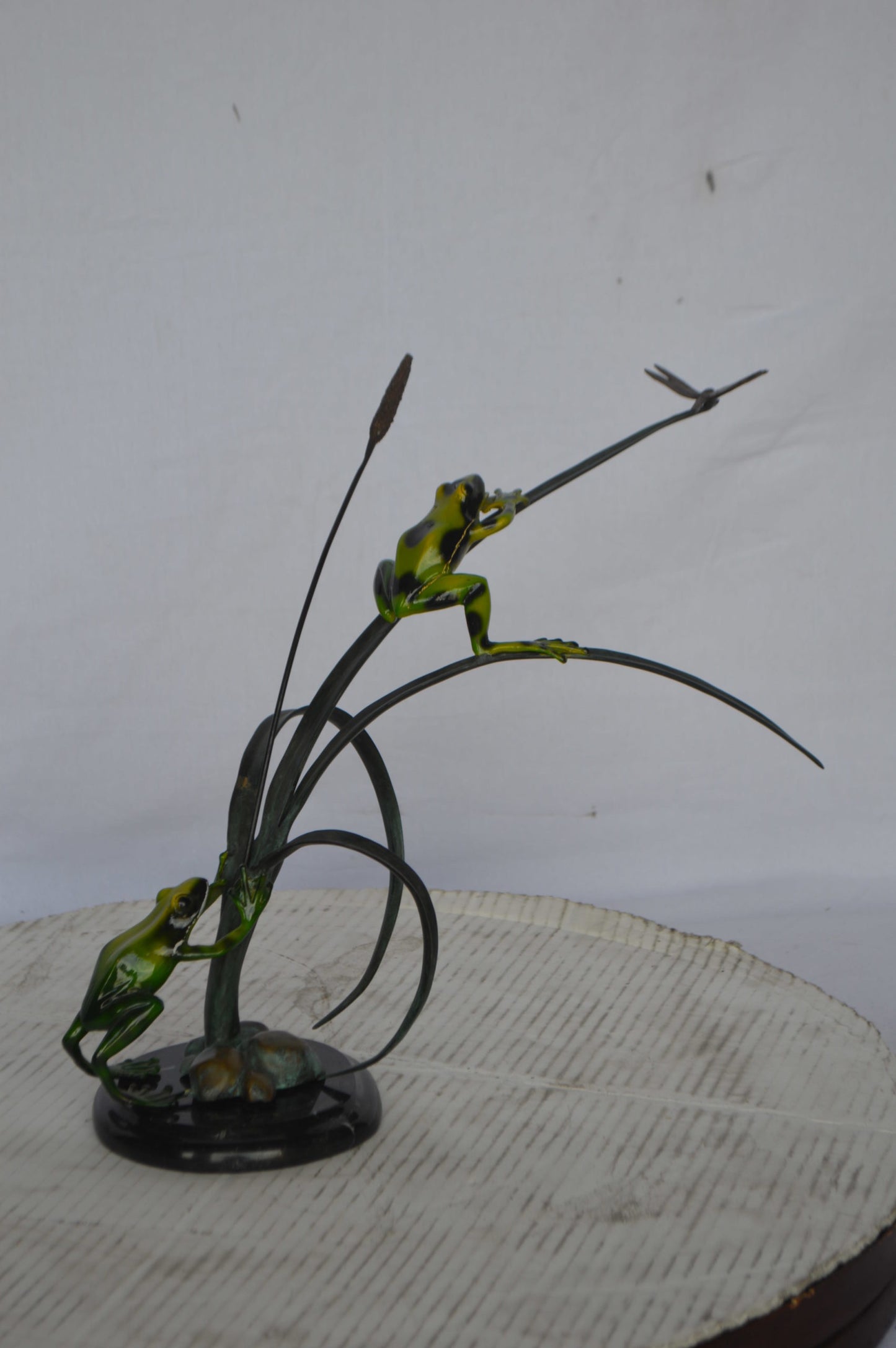 Two Green Frogs catching a dragonfly Bronze Statue - Size: 17"L x 10"W x 13"H.