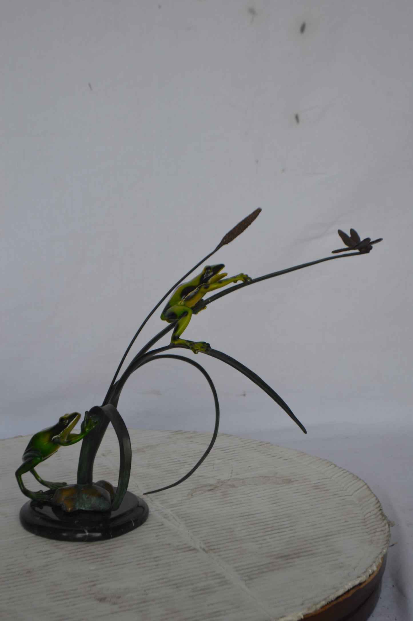 Two Green Frogs catching a dragonfly Bronze Statue - Size: 17"L x 10"W x 13"H.
