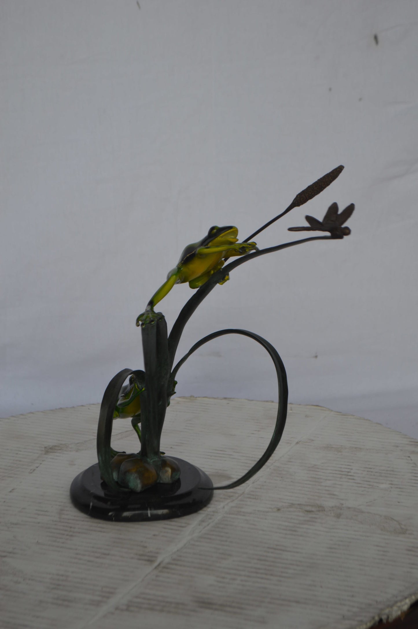 Two Green Frogs catching a dragonfly Bronze Statue - Size: 17"L x 10"W x 13"H.