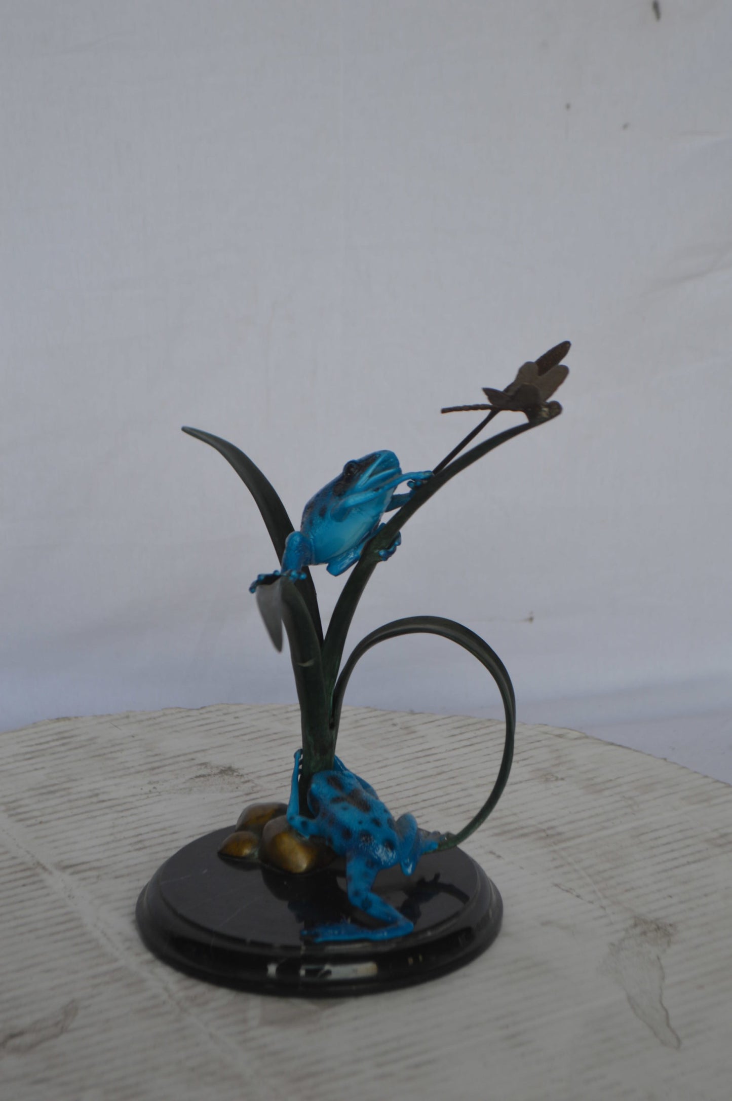 Two Blue Frogs catching a dragonfly Bronze Statue - Size: 14"L x 8"W x 12"H.