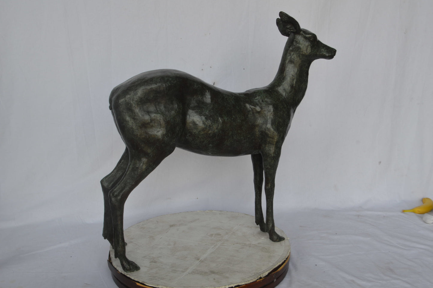 Doe - Baby Deer Green patina Bronze Statue - Size: 30"L x 8"W x 31"H.