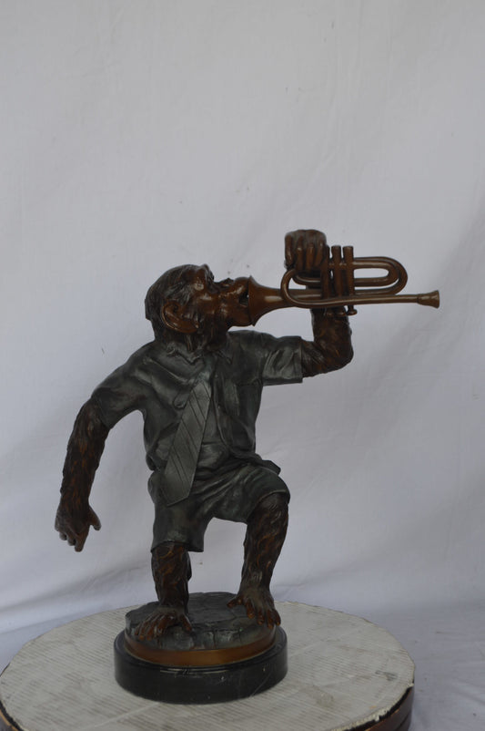 Monkey With Trumpet Bronze Statue - Size: 24"L x 12"W x 26"H.