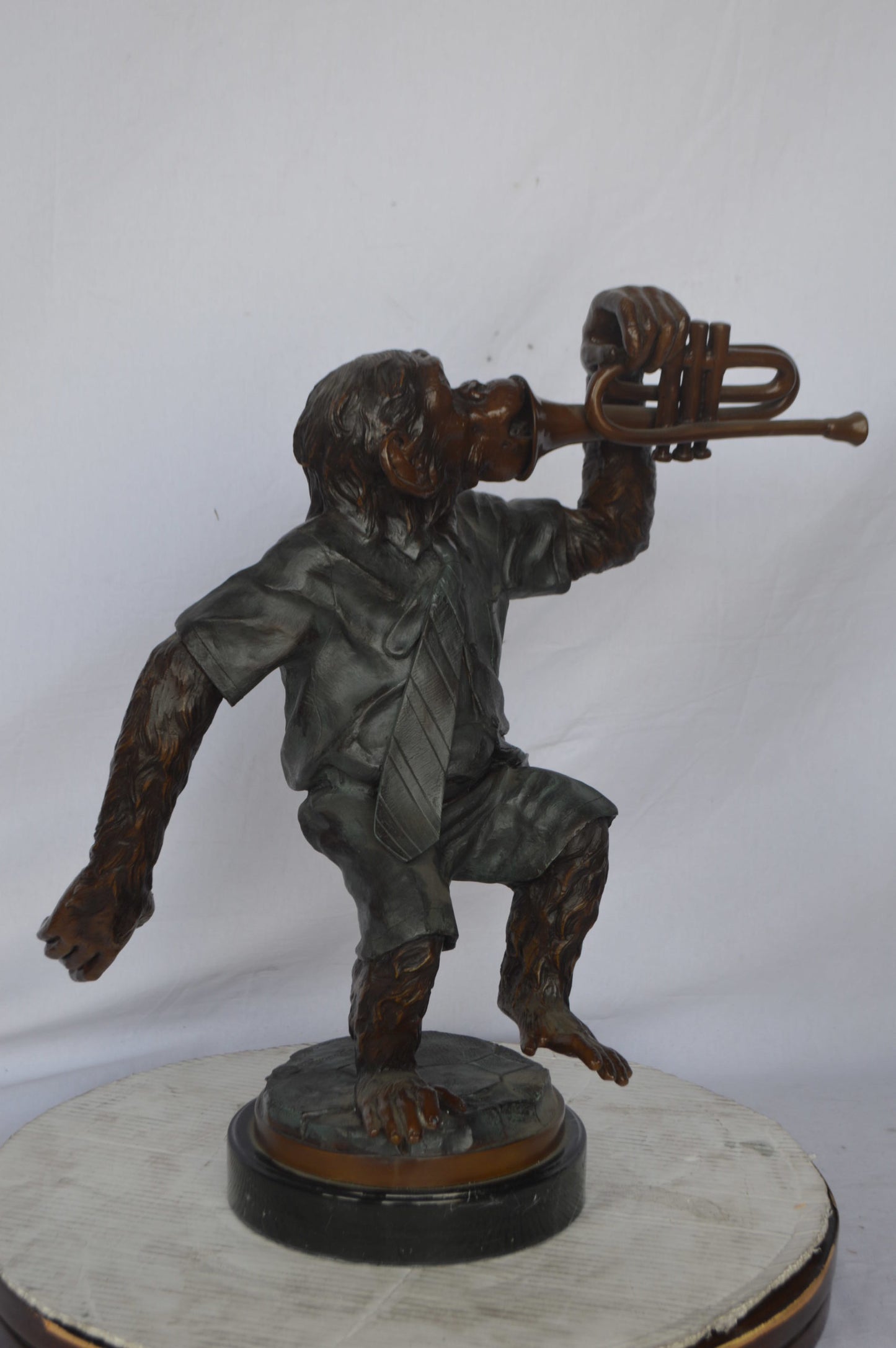 Monkey With Trumpet Bronze Statue - Size: 24"L x 12"W x 26"H.