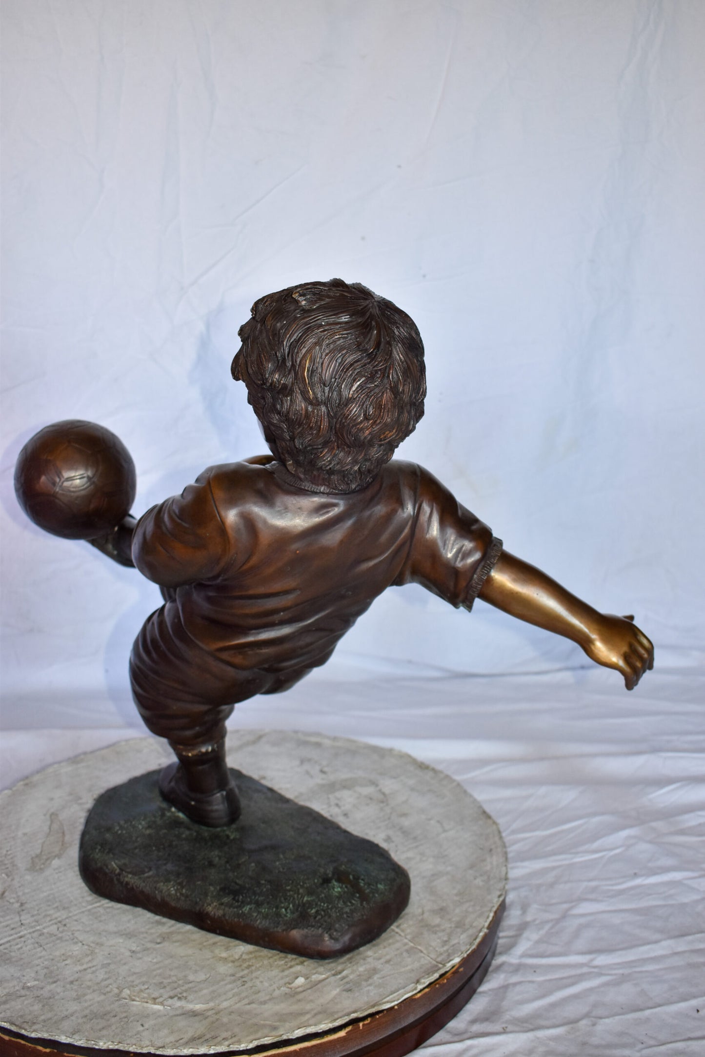 Young Boy Passionately Kicking Soccer Ball Bronze Statue  Size: 26" x 16" x 24"H